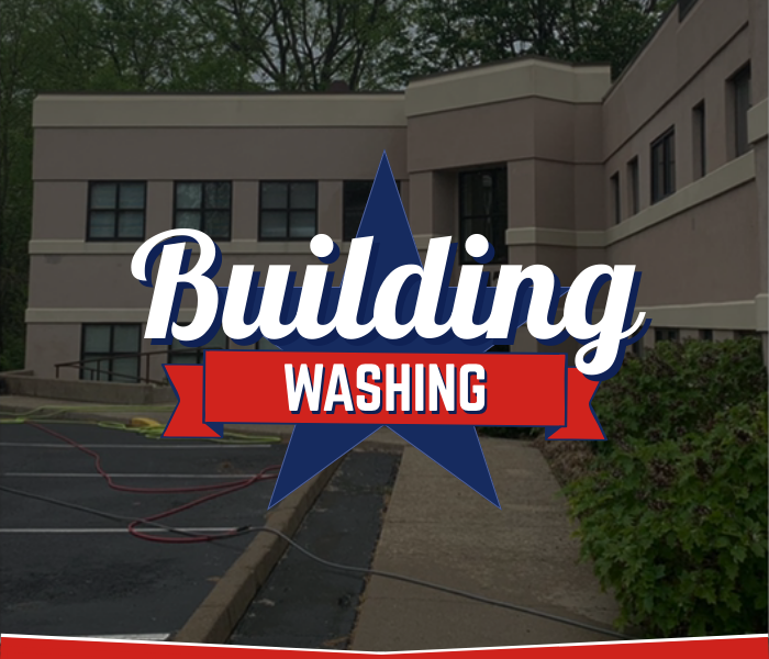Commercial building exterior prepared for soft washing by Great American Soft Wash.