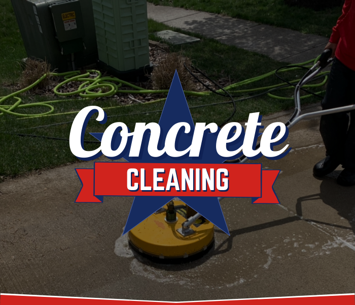 Surface cleaner being used by Great American Soft Wash technician to clean a concrete sidewalk.