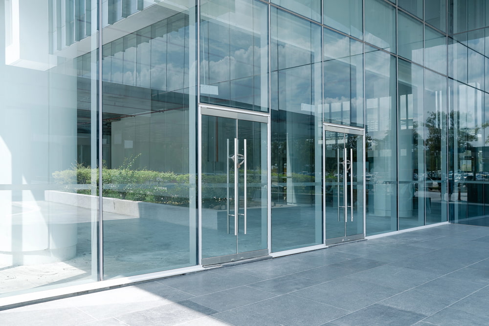 Empty ground in front of modern buildings with clean window